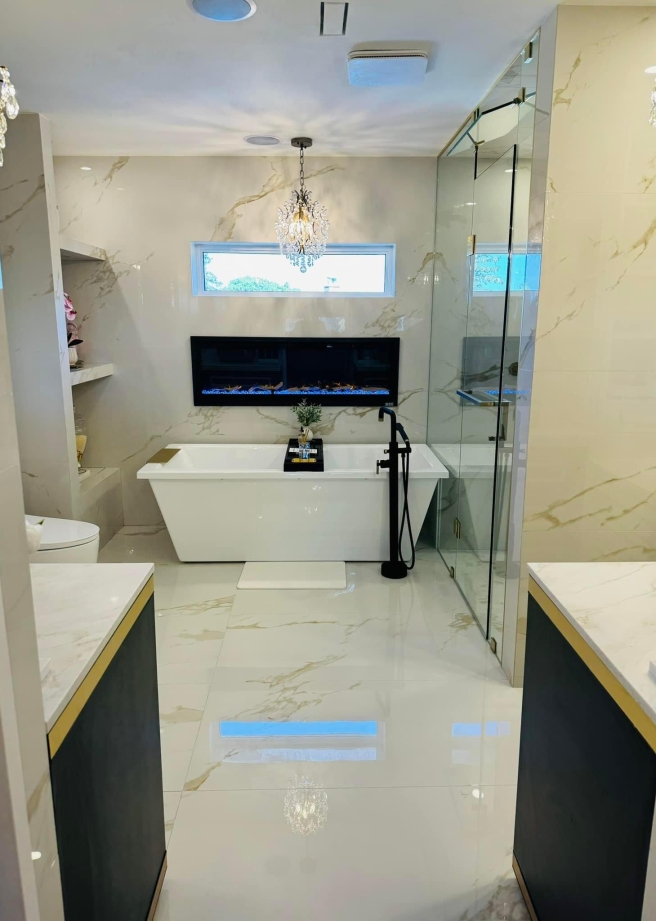 Modern bathroom with wooden shelves and backlit mirror